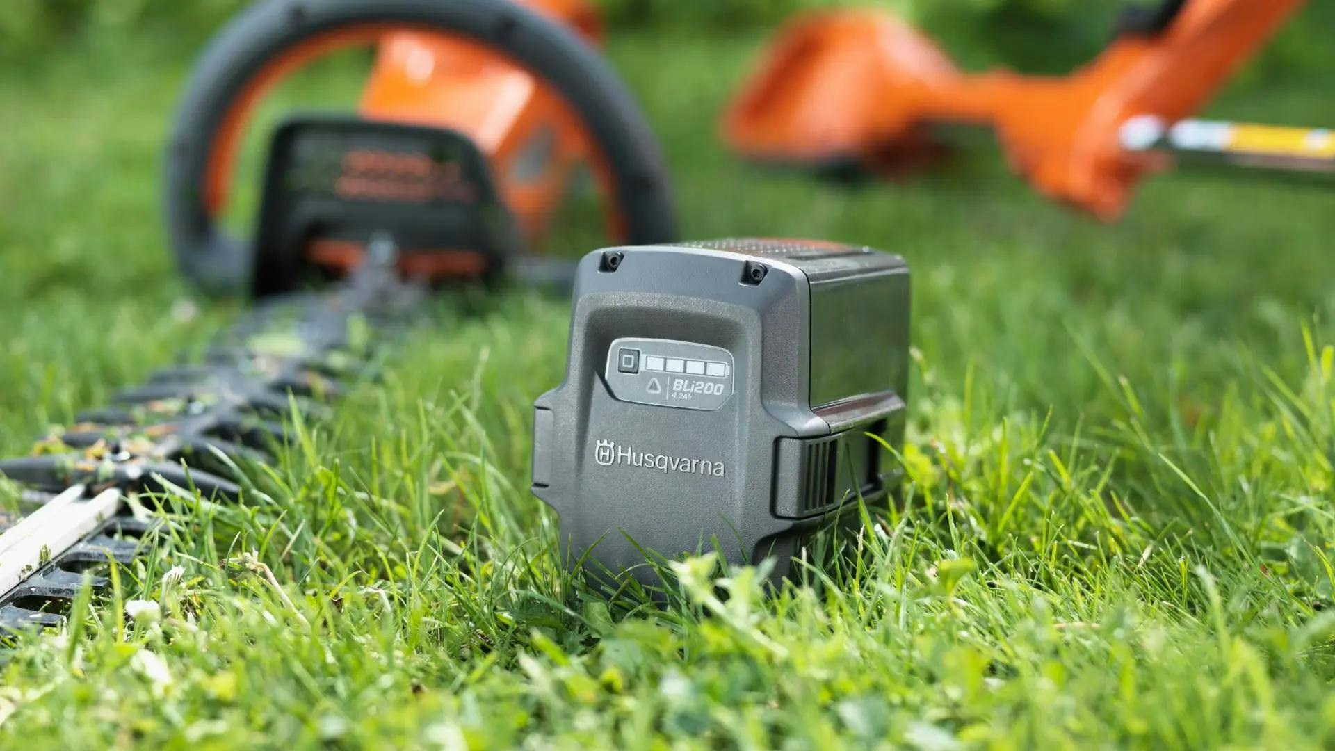 husqvarna battery in green grass